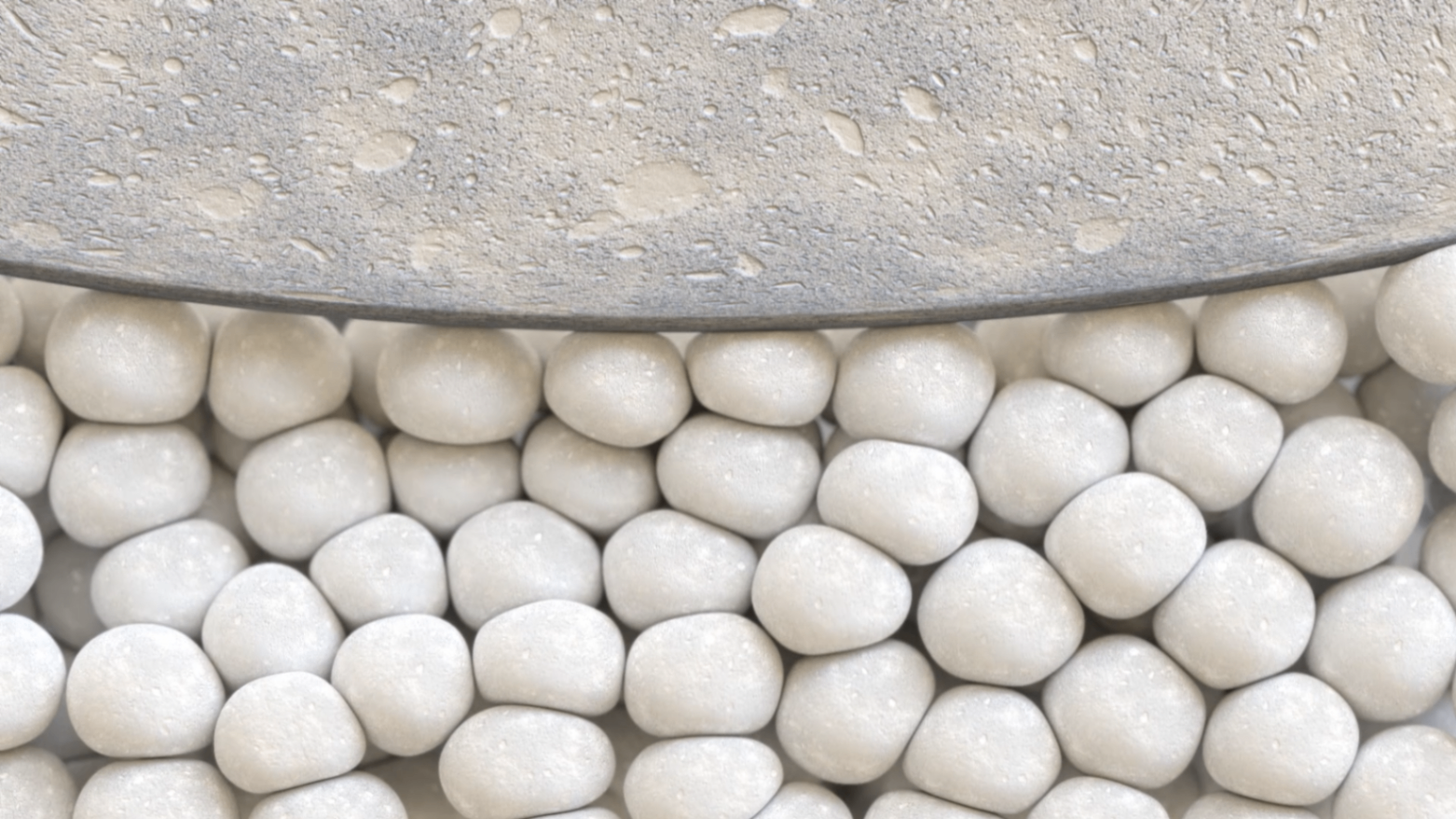 Close-up CGI of rounded material particles beneath a textured surface